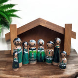 Wharenui with Māori whānau pegs