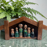 Wharenui with Māori whānau pegs