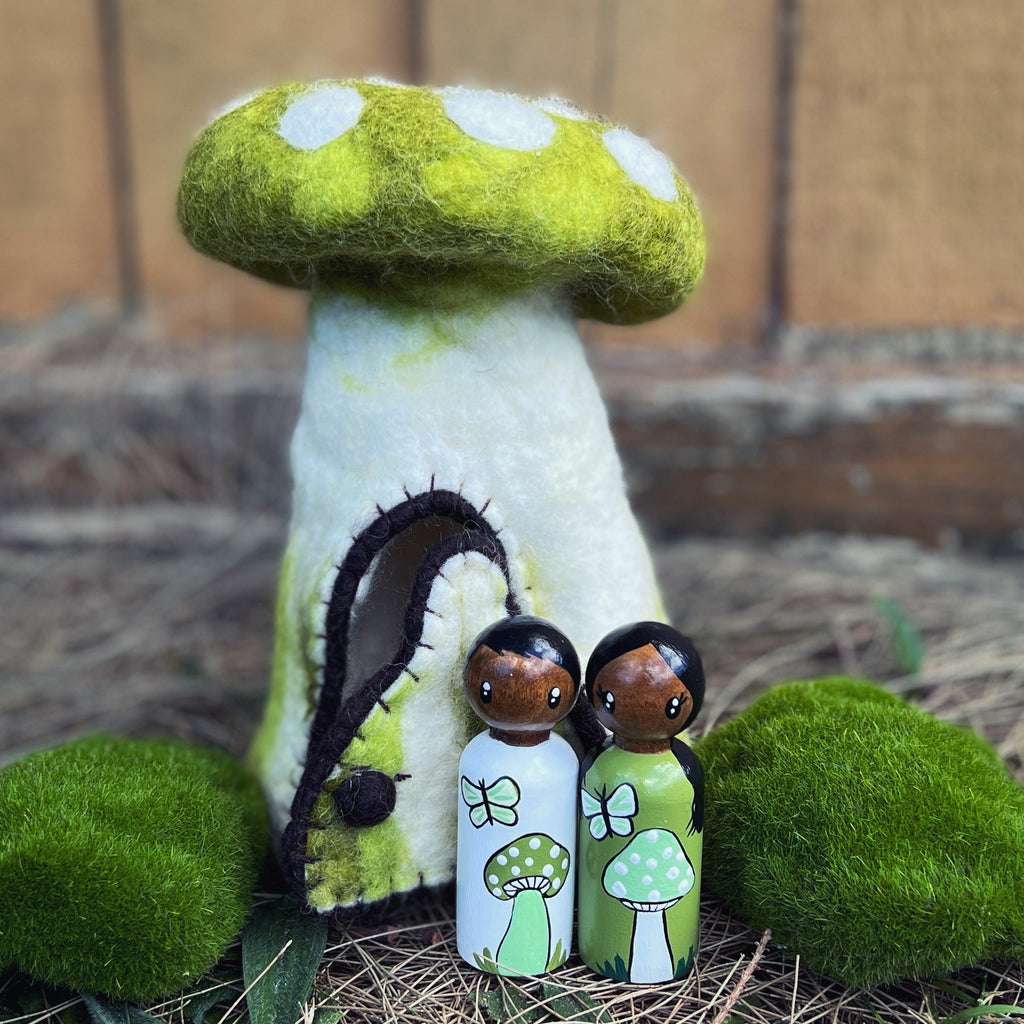 Hollow Toadstool homes with large peg people – Weewoodenwondersnz